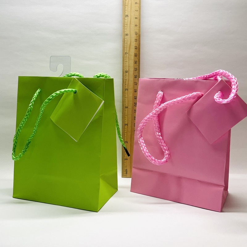 Pink and shop green gift bags