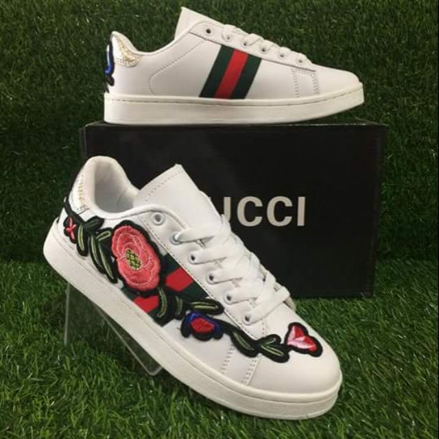 Gucci sneakers store with roses