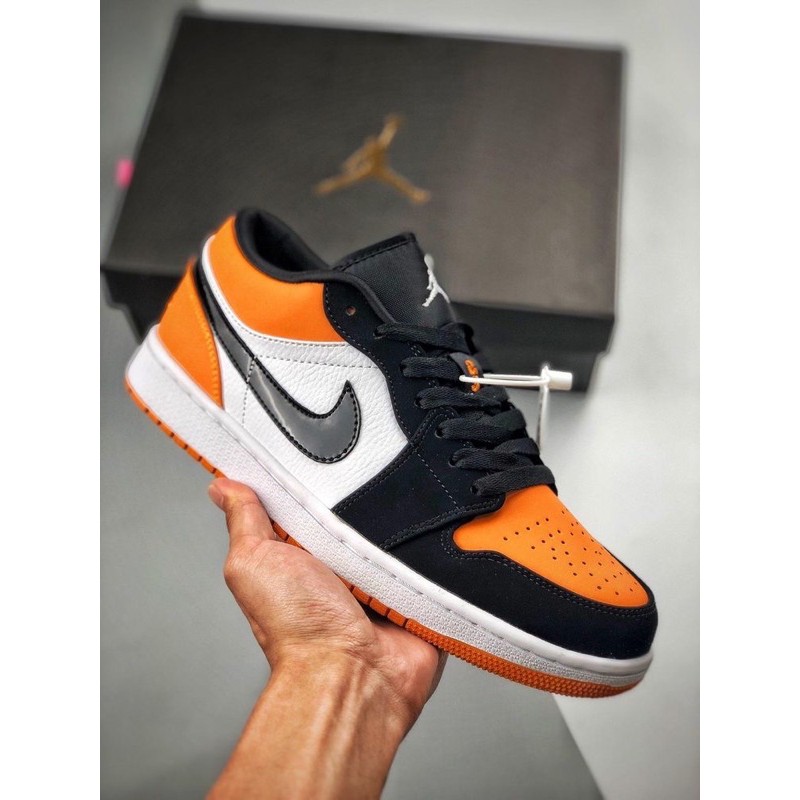 Orange and black jordan 1 outlet low