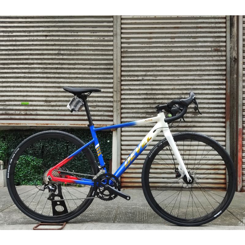 Devel road bike deals price