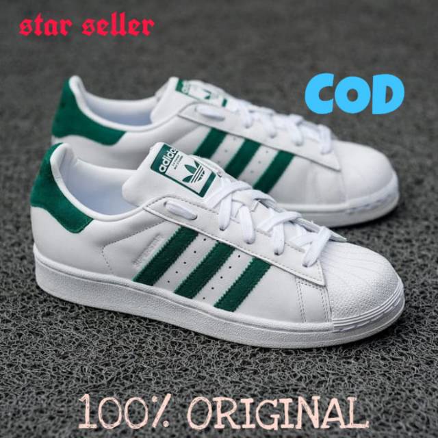 Adidas superstar shop with green stripes