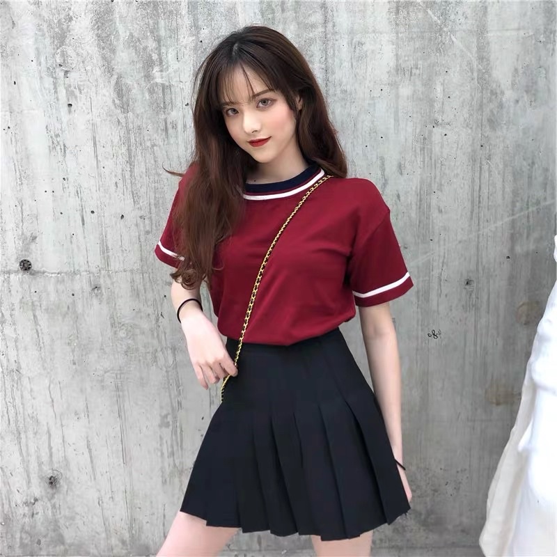 Black skirt red store shirt outfit