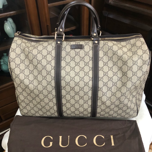 Used gucci hot sale duffle bag