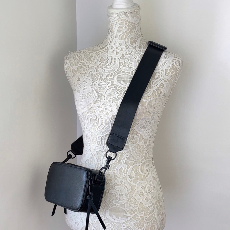 Handbag with sling clearance strap